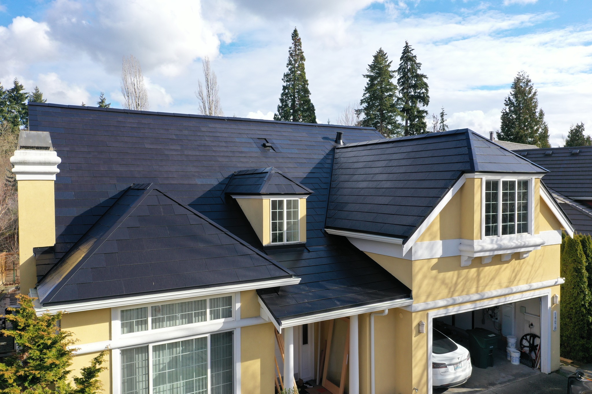 Completed Tesla Solar Roof installation on Bellevue home with clean roofline and no visible mounting hardware