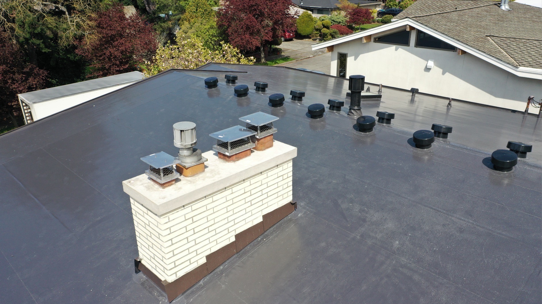 Seattle PVC roof chimney flashing and masonry detail
