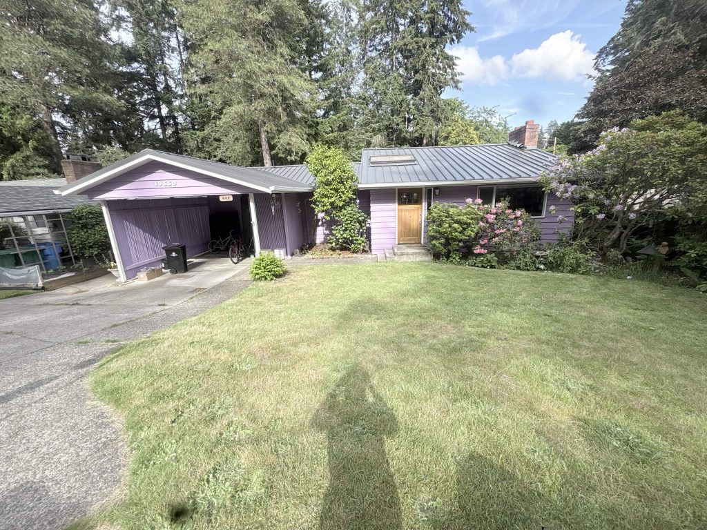 Street view of a Shoreline home with a new Nu-Ray standing seam metal roof and solar installation