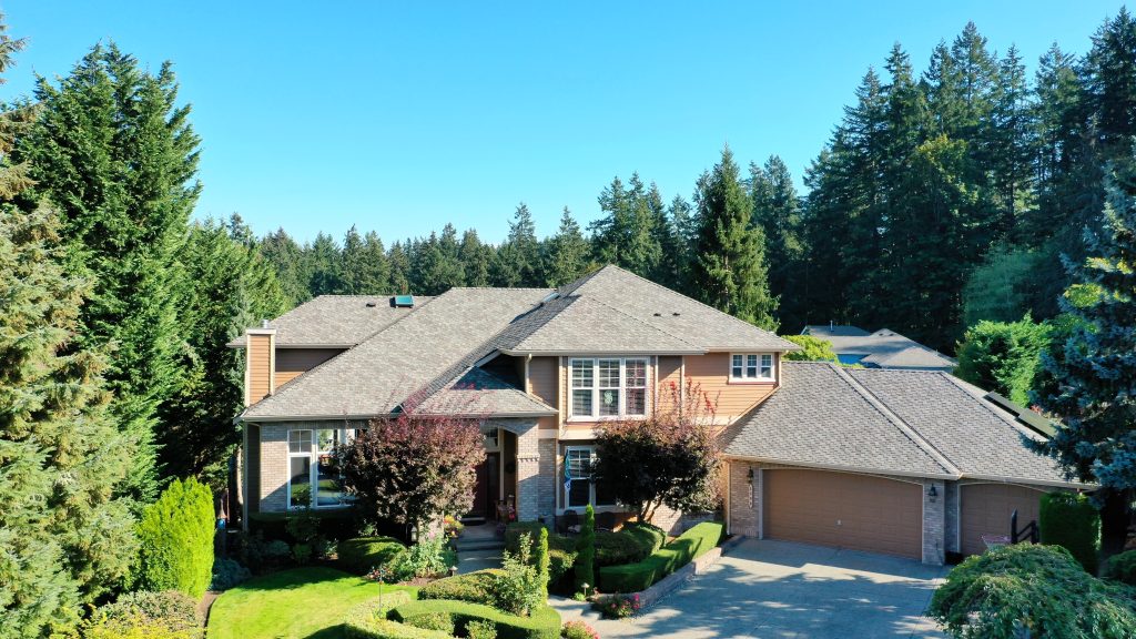 Street view of a Renton, WA home featuring a new CertainTeed Presidential Shake roof in Country Gray by Pinnacle Roofing.