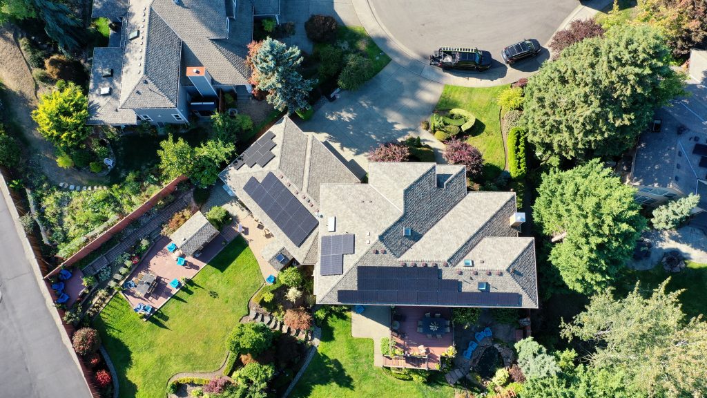 Aerial view of new CertainTeed Presidential Shake shingles in Country Gray with rooftop solar arrays on a Renton, WA home.