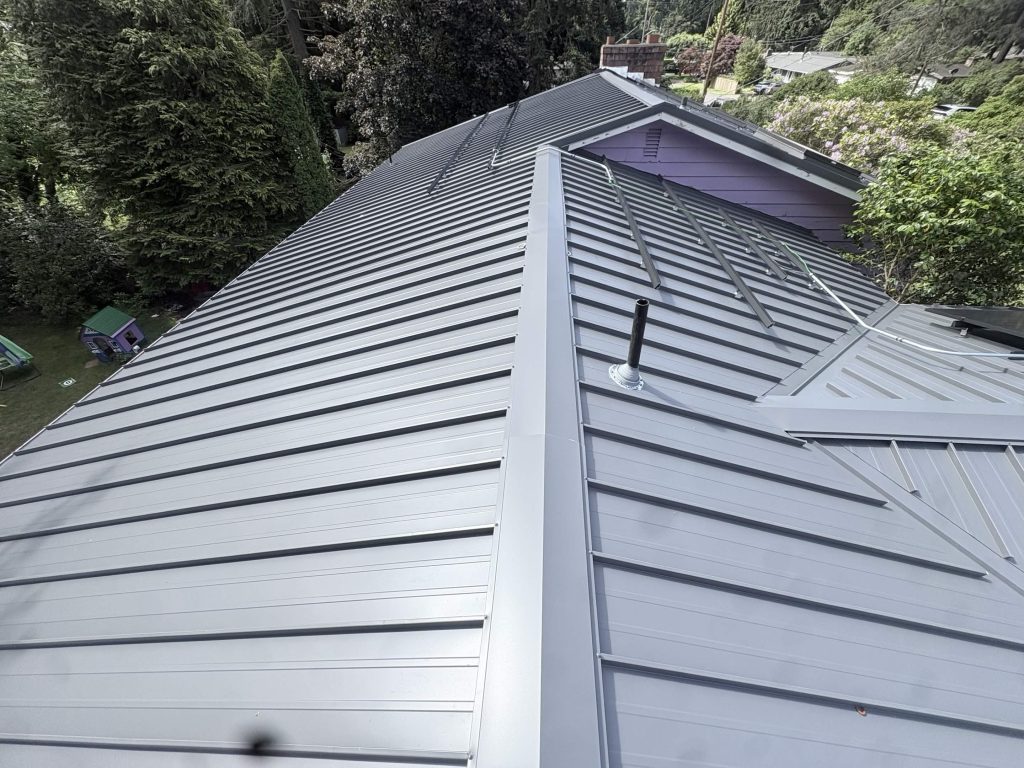 Close-up of Nu-Ray standing seam metal roof on a Shoreline home with solar mounting rails