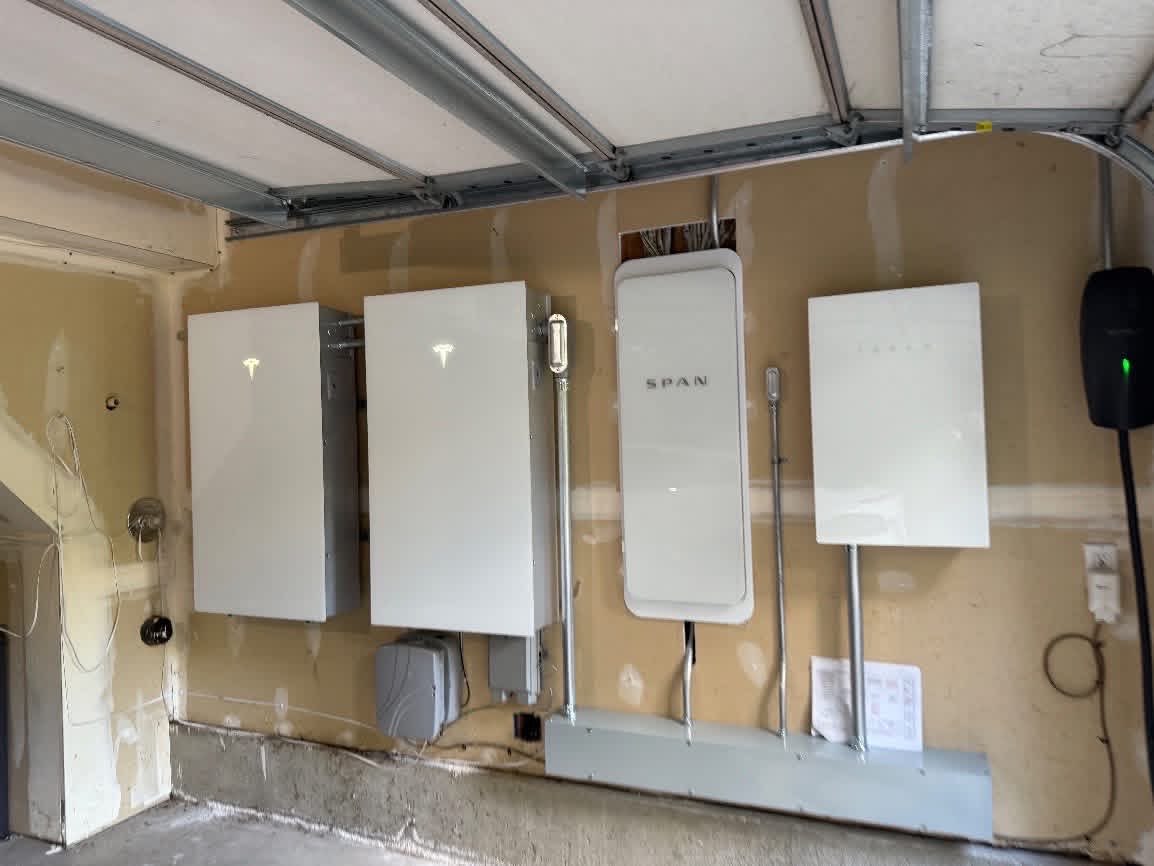 SPAN smart electrical panel, conduit runs, and Tesla Wall Connector EV charger for a Leschi Seattle solar and Powerwall 3 installation