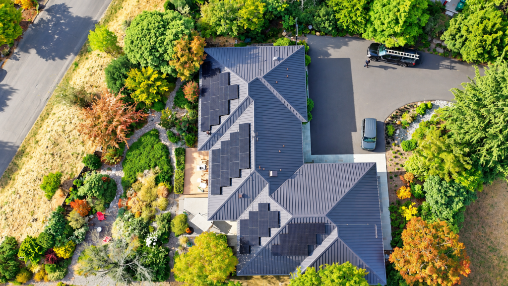 Garden and trees at a West Seattle, WA home with a Nu-Ray metal roof and solar energy system