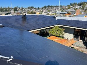Aerial view of the Tesla Solar Roof V2 installation in progress in Anacortes, WA